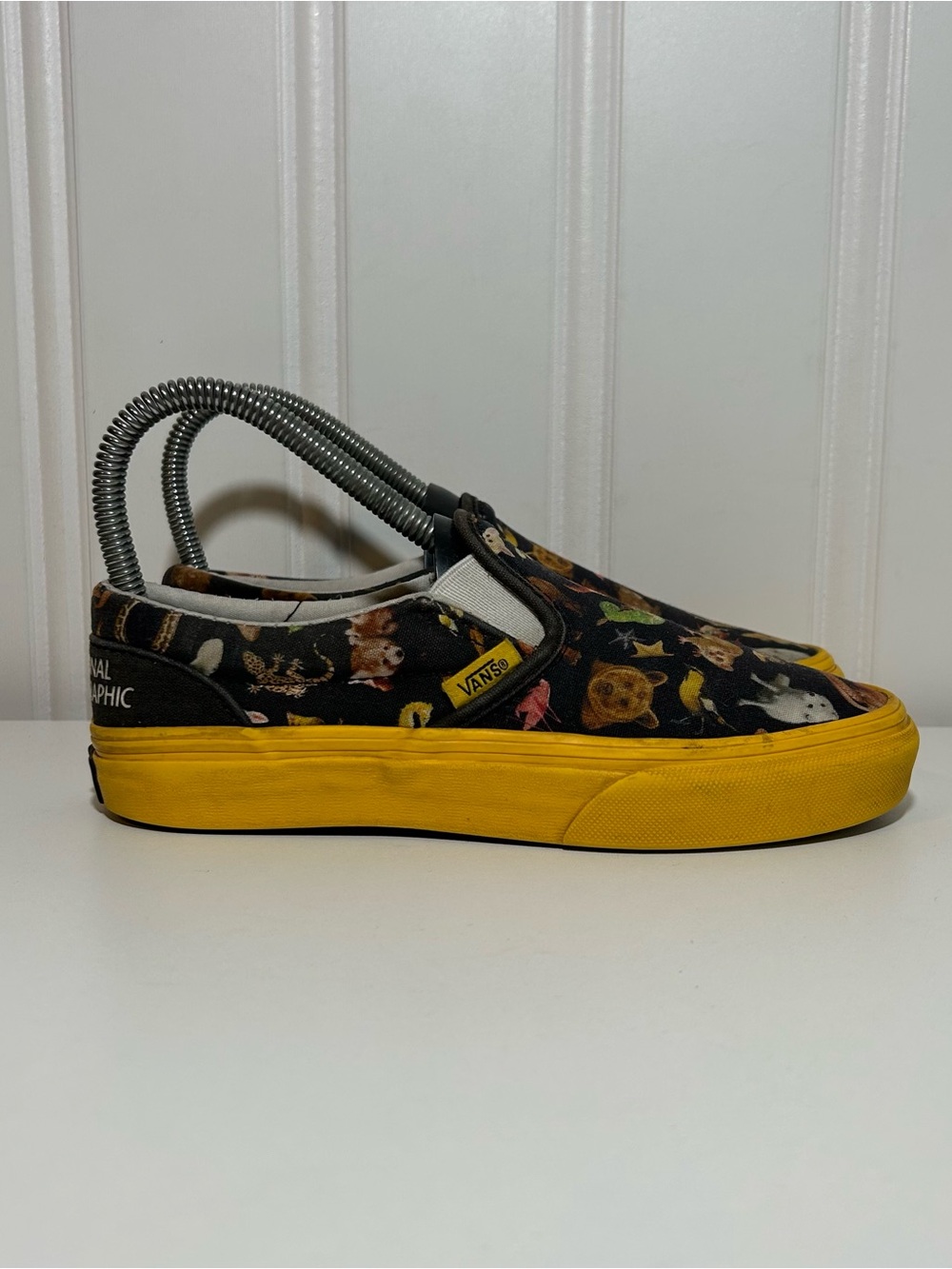 Vans Slip On National Geographic Sneakers in Black and Yellow animal print